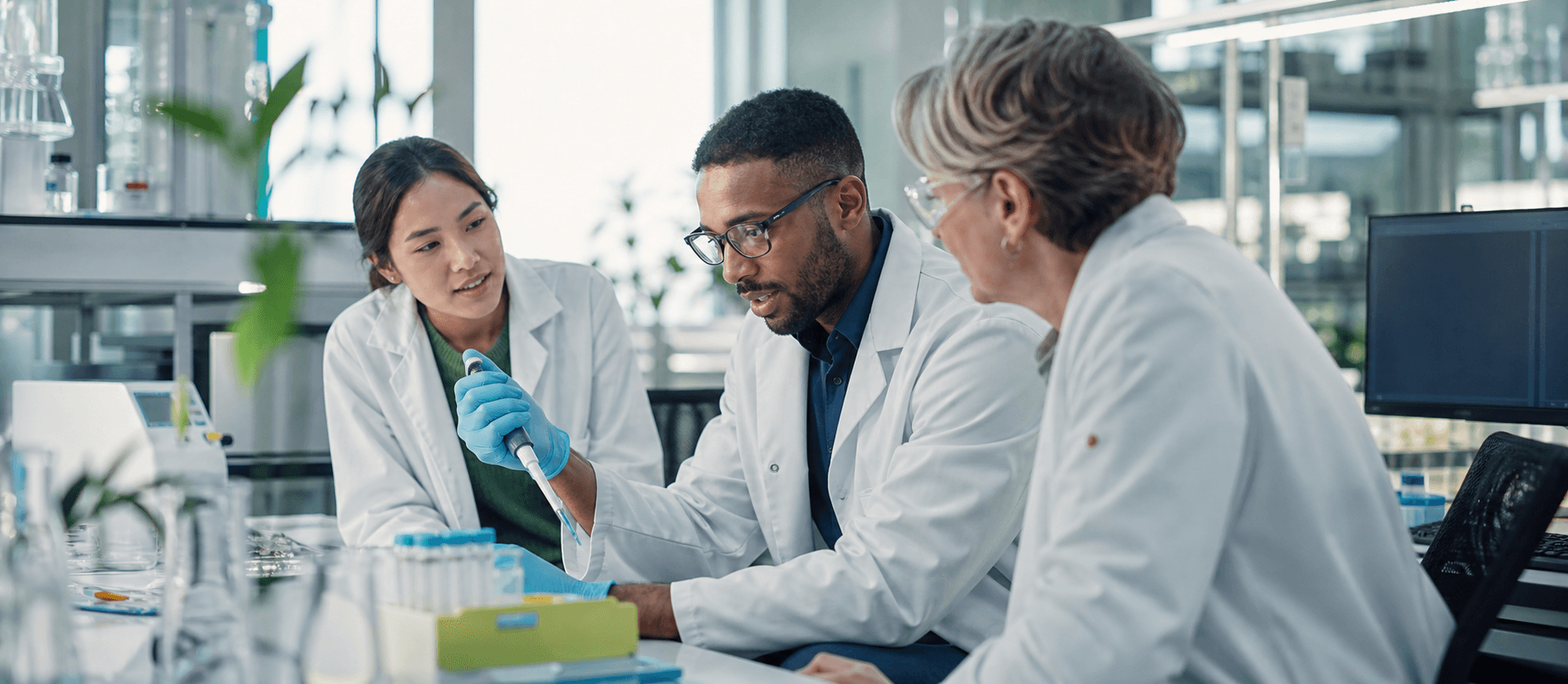 Scientists collaborating in a molecular biology laboratory